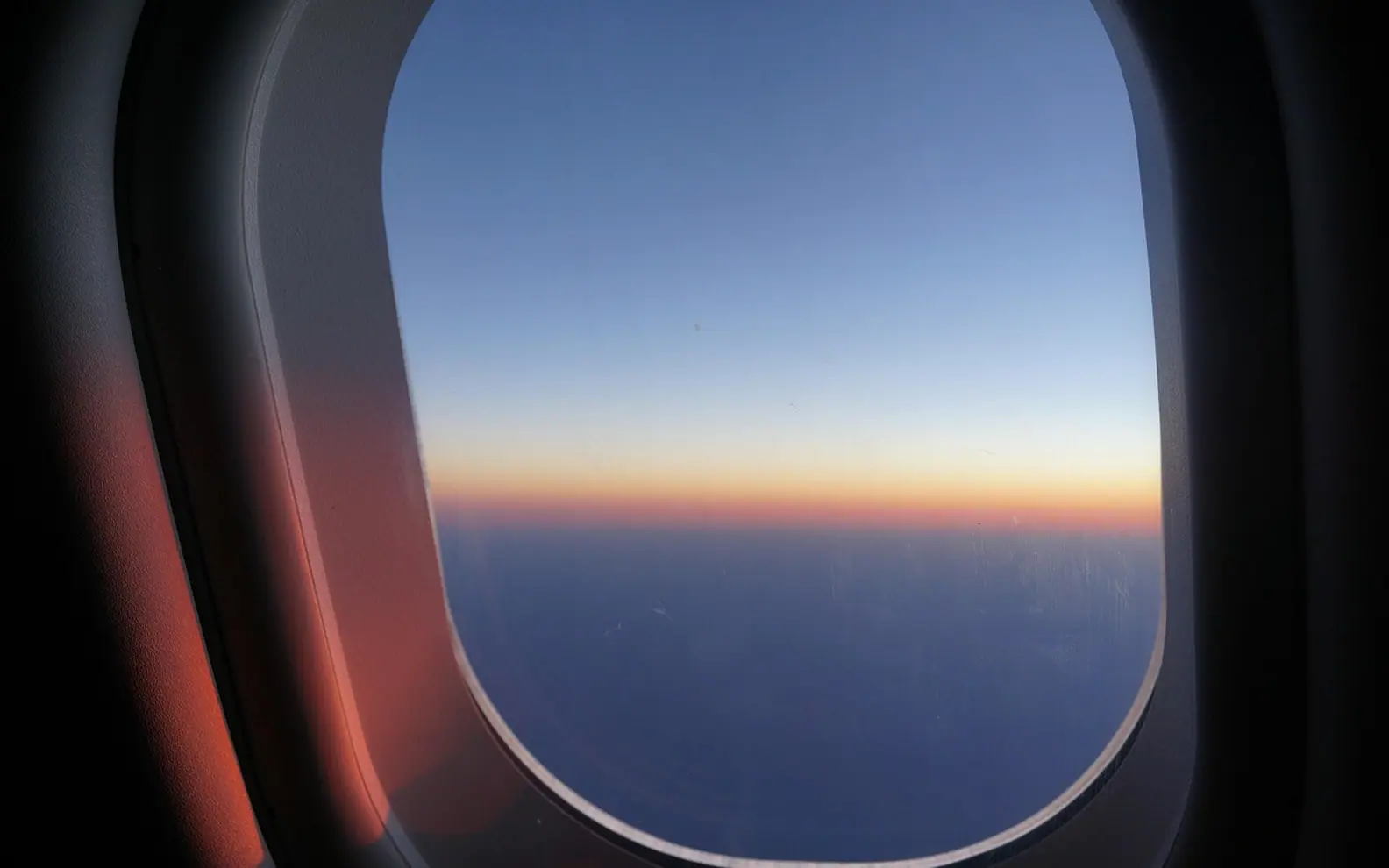 Window seat, sunrise in the skies and daybreak